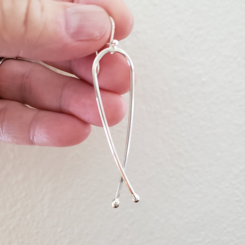 Long silver fish earrings christian jewelry